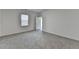 Bright bedroom offers neutral walls and carpet, a window, and convenient closet access at 1659 Hay Patch Ln, Loganville, GA 30052