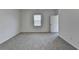 Spacious bedroom features neutral carpet, bright natural light, and a walk-in closet at 1659 Hay Patch Ln, Loganville, GA 30052