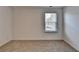 Comfortable bedroom with a bright window, neutral walls, and plush carpeting at 1659 Hay Patch Ln, Loganville, GA 30052