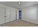 A bright bedroom with neutral carpet and a closet in view at 1659 Hay Patch Ln, Loganville, GA 30052