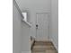 Bright entryway showcasing wood-look floors and a staircase leading to the upper level at 1659 Hay Patch Ln, Loganville, GA 30052
