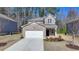 Charming two-story home with brick accents and a well-manicured front yard, perfect for a Gathering at 1659 Hay Patch Ln, Loganville, GA 30052