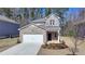 Charming two-story home with brick accents and a well-manicured front yard, perfect for a Gathering at 1659 Hay Patch Ln, Loganville, GA 30052