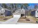Charming two-story home with brick accents and a well-manicured front yard, perfect for a Gathering at 1659 Hay Patch Ln, Loganville, GA 30052