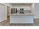 The kitchen has granite countertops, stainless appliances, and white cabinetry at 1659 Hay Patch Ln, Loganville, GA 30052