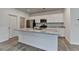 This kitchen features granite countertops, stainless appliances, and white cabinetry at 1659 Hay Patch Ln, Loganville, GA 30052