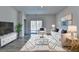 Stylish living room with modern decor, plush seating, and a sliding door for natural light at 1659 Hay Patch Ln, Loganville, GA 30052