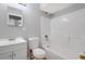 Standard bathroom with a shower-tub combo, gray walls, and a sink with a white cabinet at 2522 Brentwood Ct, Decatur, GA 30032
