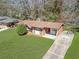 Aerial view of brick home with a well-kept lawn and a long driveway at 2522 Brentwood Ct, Decatur, GA 30032