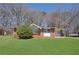 Charming single-story brick home featuring a well-manicured lawn and mature trees at 2522 Brentwood Ct, Decatur, GA 30032