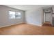 Comfortable living room featuring neutral paint, wood floors, and a large window at 2522 Brentwood Ct, Decatur, GA 30032