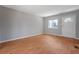 Comfortable living room featuring neutral paint, wood floors, and a bright front door at 2522 Brentwood Ct, Decatur, GA 30032