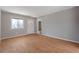 Inviting living room featuring neutral paint, wood floors, and a bright front door at 2522 Brentwood Ct, Decatur, GA 30032