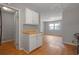 Wide shot of living room with gray paint, a window, and laminate flooring at 2522 Brentwood Ct, Decatur, GA 30032
