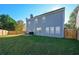 Large backyard with a wooden fence and green grass at 3820 Mast Nw Ct, Kennesaw, GA 30144