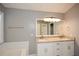 Bathroom featuring a double vanity with granite countertop and a large mirror at 3820 Mast Nw Ct, Kennesaw, GA 30144