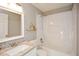 Bathroom featuring granite countertop, white cabinets, and a tub-shower combo at 3820 Mast Nw Ct, Kennesaw, GA 30144
