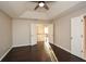 Spacious bedroom features high ceiling, hardwood floors and open door to adjoining area at 3820 Mast Nw Ct, Kennesaw, GA 30144