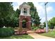 Bell tower surrounded by colorful flowers and greenery, adding charm to Legacy Park at 3820 Mast Nw Ct, Kennesaw, GA 30144