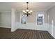 Inviting dining room showcasing classic wainscoting details, updated floors, and ample natural light at 3820 Mast Nw Ct, Kennesaw, GA 30144