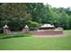 Wyndham entrance with brick sign surrounded by flowers and manicured lawn at 3820 Mast Nw Ct, Kennesaw, GA 30144