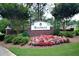 Community entrance sign for Bellingrath, adorned with vibrant flowers and lush landscaping at 3820 Mast Nw Ct, Kennesaw, GA 30144