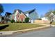 View of a two-story home with a brick and siding exterior with driveway and a lawn on the side at 3820 Mast Nw Ct, Kennesaw, GA 30144