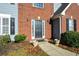 Close-up view of the brick and siding facade of the two-story home with a front door at 3820 Mast Nw Ct, Kennesaw, GA 30144