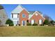 Inviting two-story home with a combination brick and siding facade and a well-maintained lawn at 3820 Mast Nw Ct, Kennesaw, GA 30144