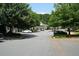 Spacious parking lot with mature trees and easy access to the building entrance at 3820 Mast Nw Ct, Kennesaw, GA 30144