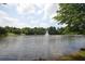 Scenic view of a pond with a water fountain feature surrounded by trees in Legacy Park at 3820 Mast Nw Ct, Kennesaw, GA 30144