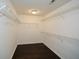 Ample storage is offered in this walk-in closet with wire shelving and hardwood floors at 3820 Mast Nw Ct, Kennesaw, GA 30144