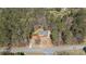 Aerial view of a charming home surrounded by lush greenery, showcasing its private setting at 4053 Thompson Mill Rd, Buford, GA 30519