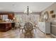 Bright dining area features a chandelier, french doors to the back and seating for six at 4053 Thompson Mill Rd, Buford, GA 30519