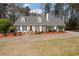 Charming single-story home with white siding, black shutters, and a well-manicured front yard at 4053 Thompson Mill Rd, Buford, GA 30519