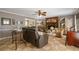 A generously sized living area features a brick fireplace, elegant decor, and neutral tones at 4053 Thompson Mill Rd, Buford, GA 30519