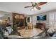 Spacious living room with fireplace, tile floors, and large windows with ample seating at 4053 Thompson Mill Rd, Buford, GA 30519