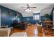 Spacious office area featuring a ceiling fan, hardwood floors, and a window at 4053 Thompson Mill Rd, Buford, GA 30519