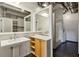 Modern bathroom with exposed pipes, walk in shower, dual mirrors, and pedestal sink at 878 Peachtree # 522, Atlanta, GA 30309