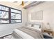 Bright bedroom featuring a large window, minimalist décor, and a comfortable-looking bed at 878 Peachtree # 522, Atlanta, GA 30309