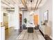 Dining room with modern lighting fixture, sleek furniture, and wood accent wall at 878 Peachtree # 522, Atlanta, GA 30309