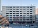 Multi-story building exterior showcasing classic architecture and street-level businesses at 878 Peachtree # 522, Atlanta, GA 30309