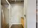 Hallway area with exposed ceiling, stainless refrigerator, and light cabinets at 878 Peachtree # 522, Atlanta, GA 30309