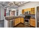 Well-equipped kitchen with stainless steel appliances, granite countertops, and wooden cabinets at 878 Peachtree # 522, Atlanta, GA 30309