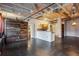 Spacious living room features exposed ceilings, an open layout, wood accent wall and industrial design at 878 Peachtree # 522, Atlanta, GA 30309