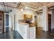 Open-concept living room and kitchen area with exposed ceiling and modern finishes at 878 Peachtree # 522, Atlanta, GA 30309