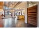 Spacious open-concept living space, with concrete floors and a modern kitchen in the background at 878 Peachtree # 522, Atlanta, GA 30309