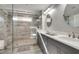 Sleek bathroom with tiled shower, double vanity, and modern fixtures at 1007 Belle Ave, Roswell, GA 30076