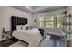 This bedroom has a large window that overlooks the backyard at 1007 Belle Ave, Roswell, GA 30076