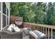 Cozy deck with outdoor seating area surrounded by green trees at 1007 Belle Ave, Roswell, GA 30076